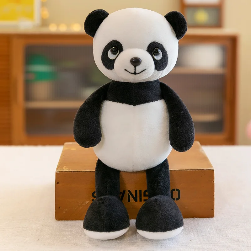 Peluche Panda 28cm - Um Companheiro Fofinho para Crianças Encante-se com o Peluche Panda 28cm, feito com materiais macios e seguros para crianças a partir de 3 anos. Ideal para momentos de aconchego ou decoração, disponível na Plushie!