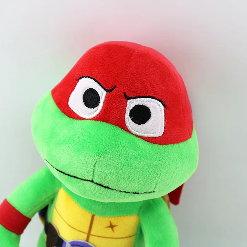 Peluche Rafael - Tartarugas Ninja 22cm - Peluche Infantil de Aventura O Peluche Rafael – Tartarugas Ninja 22cm traz toda a energia e coragem do herói rebelde da equipa. Macio, seguro e cheio de detalhes, é ideal para crianças e fãs dos filmes de aventura e fantasia.