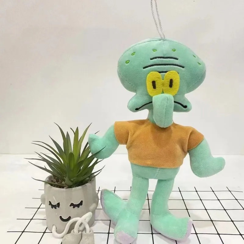 Peluche Squidward Tentáculos 23cm - SpongeBob SquarePants655N Conheça o Peluche Squidward Tentáculos 23cm, inspirado na série SpongeBob SquarePants. Macio, seguro e ideal para fãs da Nickelodeon. Envio rápido em Portugal.