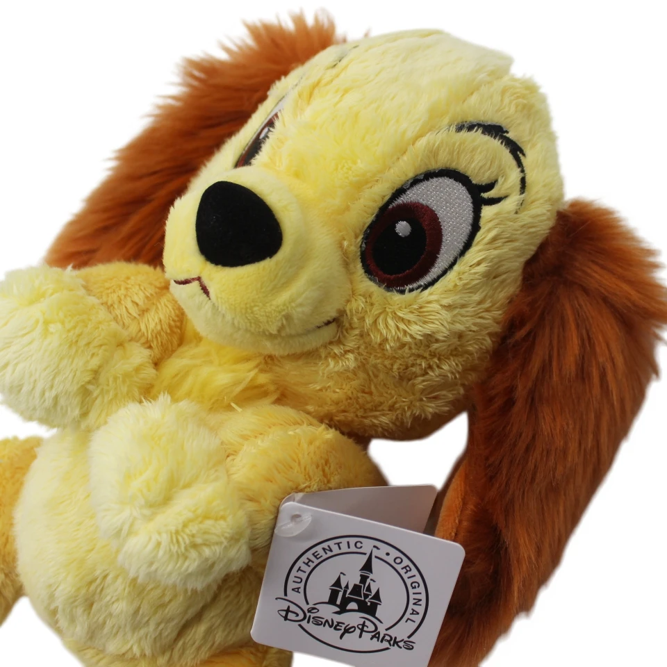 Peluche Dama - A Dama e o Vagabundo 25cm - Bonecos de Peluche da Dama e o Vagabundo Disney Descubra o Peluche Dama - A Dama e o Vagabundo 25cm. Um peluche Disney macio e encantador, perfeito para crianças, fãs dos clássicos e colecionadores.