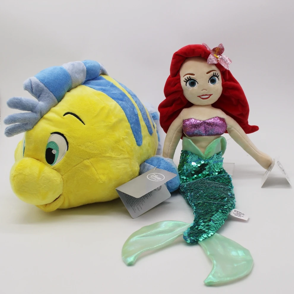 Peluche Ariel - A Pequena Sereia 40cm - Peluche Disney Macio e Encantador Descobre o mágico Peluche Ariel - A Pequena Sereia 40cm! Um peluche Disney macio, detalhado e perfeito para fãs da Ariel. Ideal para abraçar, decorar ou oferecer. Encomenda já!