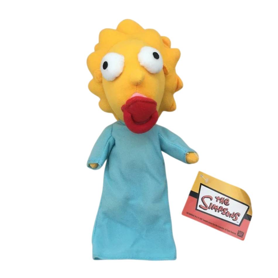 Peluche Maggie Simpson 28cm de Os Simpsons. Macio, divertido e perfeito para fãs da família Simpson. Ideal para oferecer ou completar a coleção.