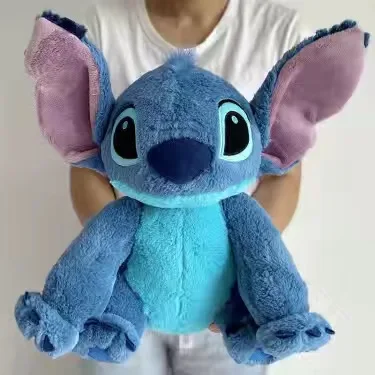 Peluche Stitch - Lilo & Stitch 40cm - Bonecos de Peluche Lilo & Stitch Peluche Stitch 40cm de Lilo & Stitch, macio e perfeito para abraçar. Descobre este peluche infantil dos filmes Disney na Plushie, com envio gratuito.